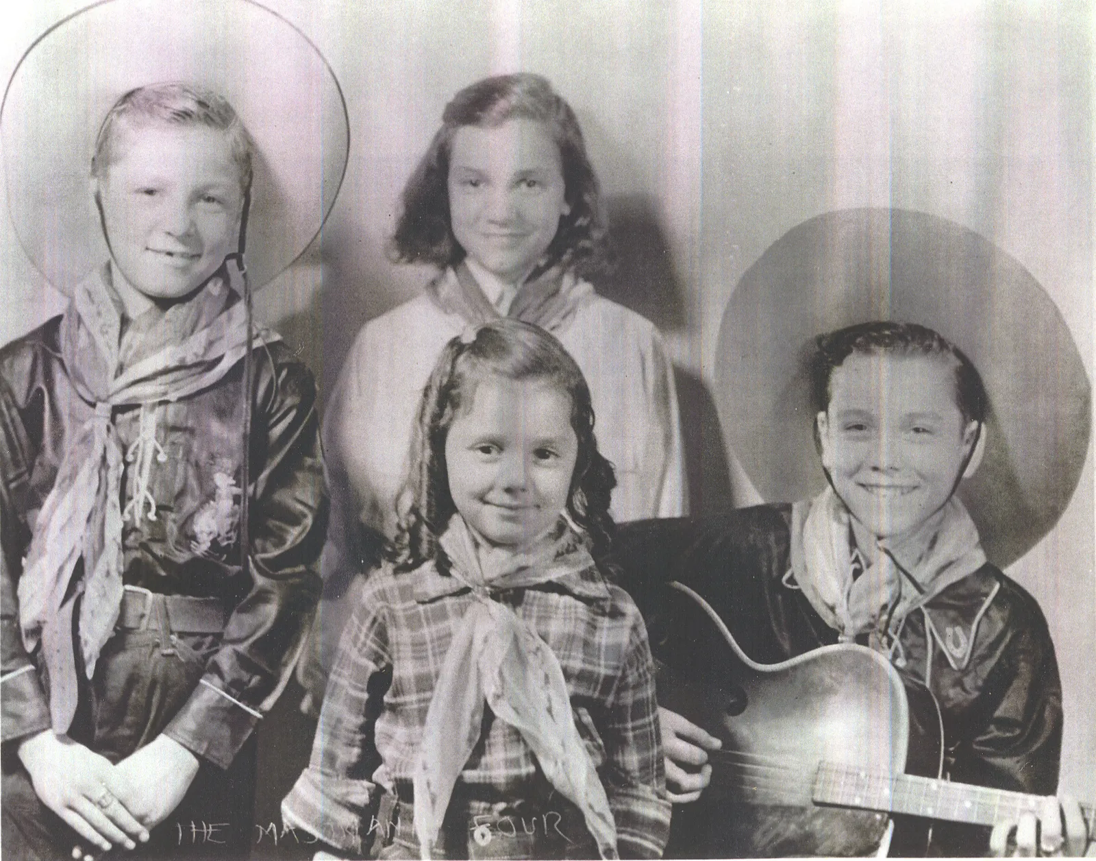 The Mastrianni Quartet — four young Plainville children dressed as cowboys with instruments